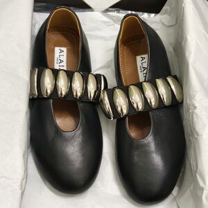 Alaia Black Leather Flats with Metallic Accents